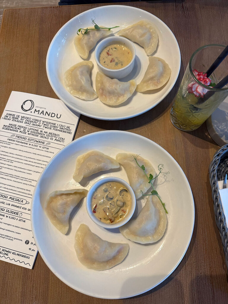 Two plates of pierogi 
