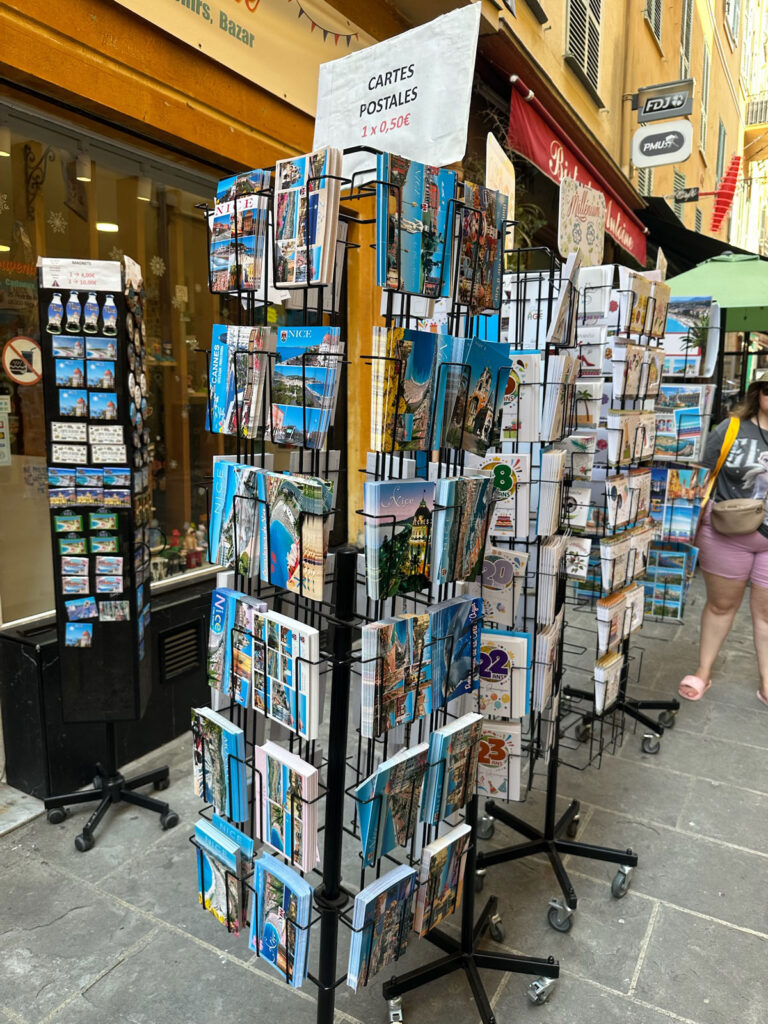 A postcard rack outside an Old Town shop