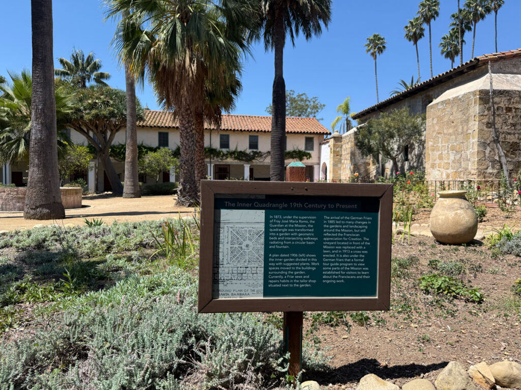 A plaque in the Mission's Inner Quadrangle garden