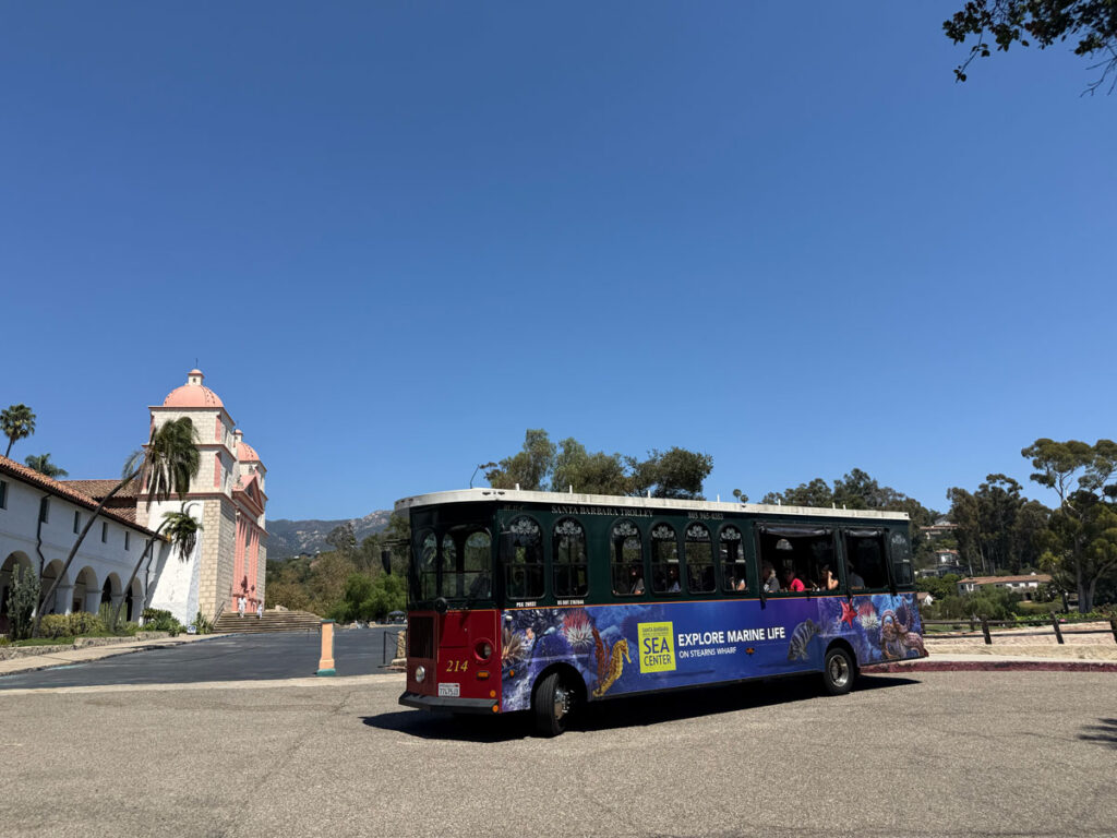 A Santa Barbara Trolley Company bus in front of Old Mission Santa Barbara