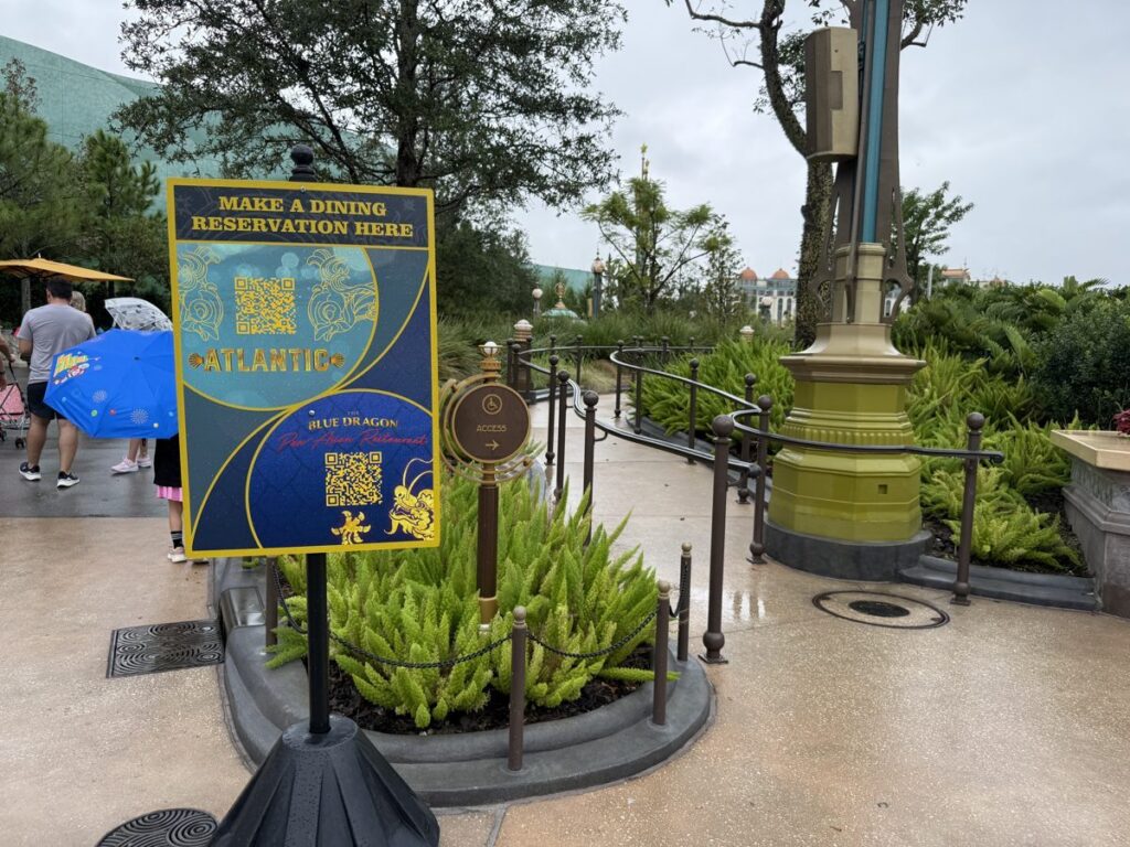A sign with QR codes for making a dining reservation at Atlantic