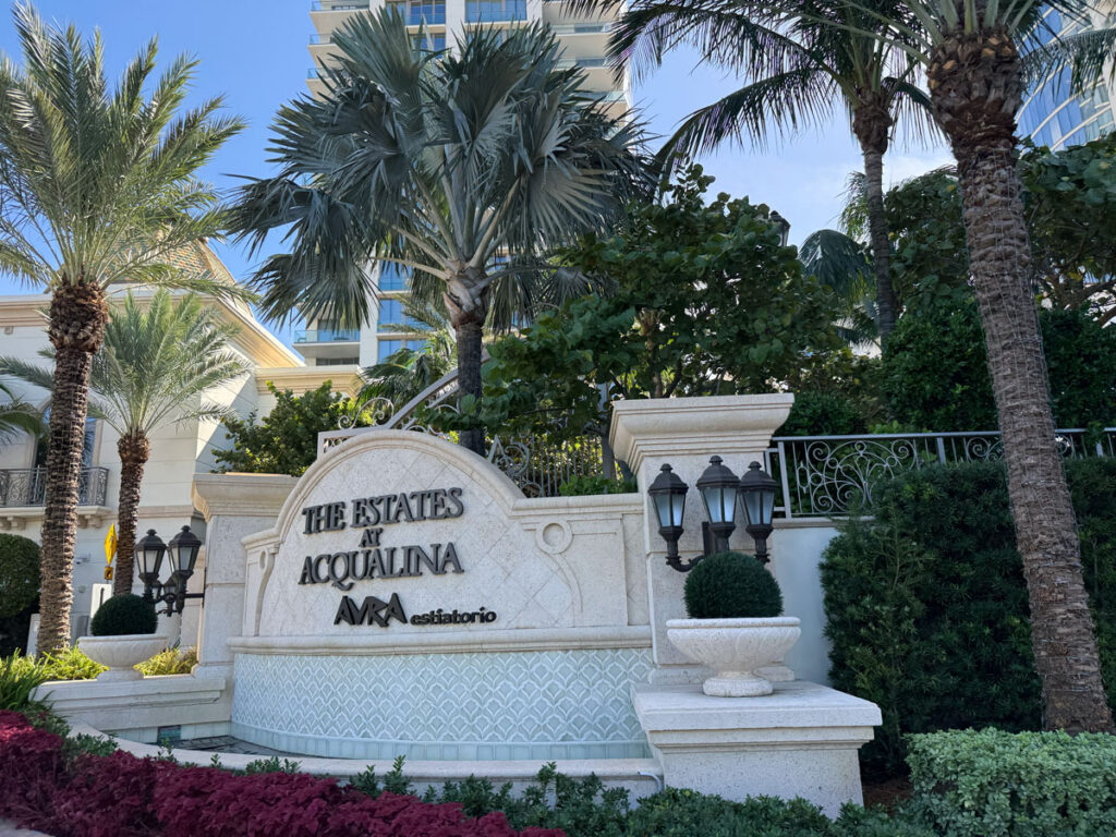 The Estates at Acqualina sign with the AVRA estiatorio name