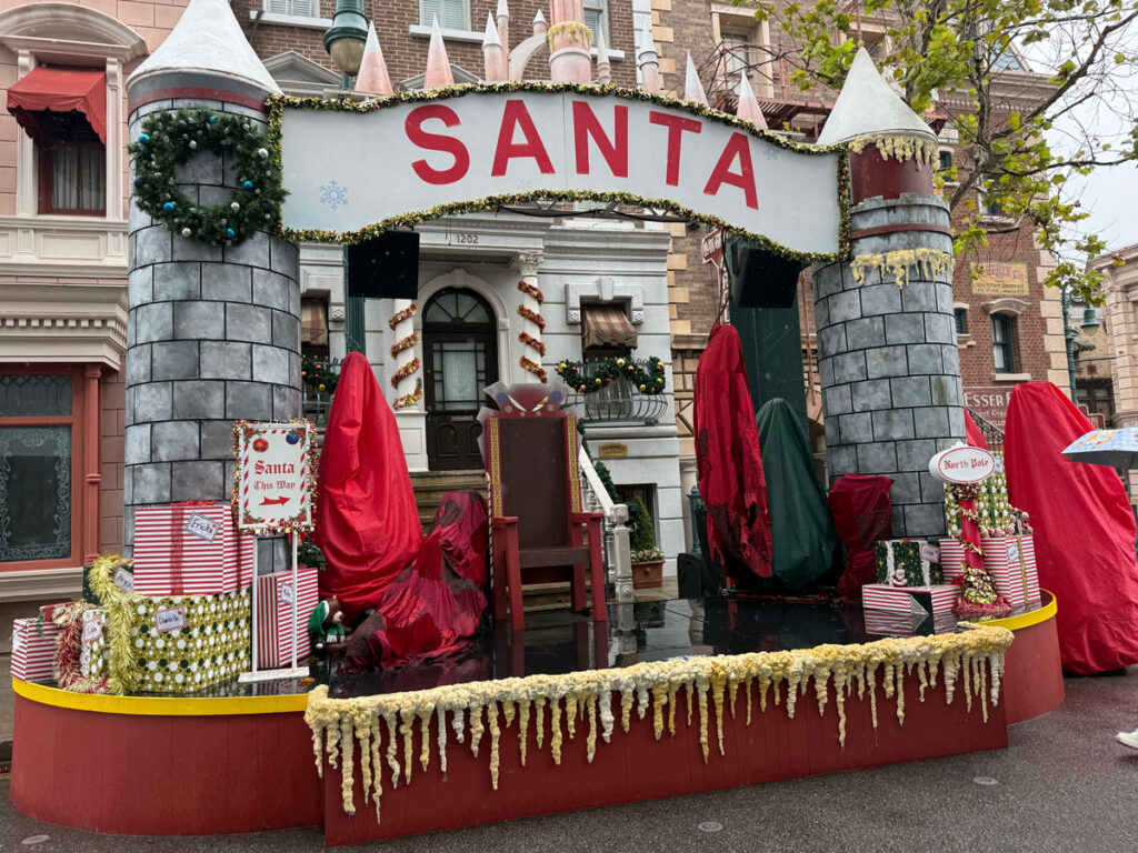 A Santa display with garland and wrapped gifts