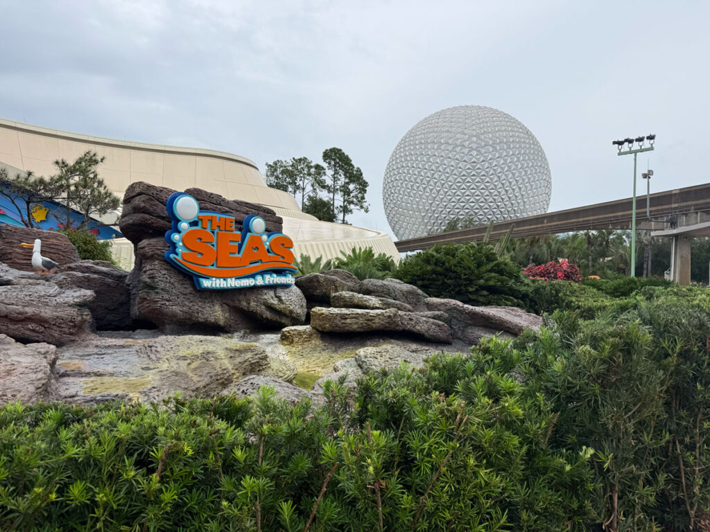 The Seas with Nemo & Friends sign on a rocky planter in World Nature